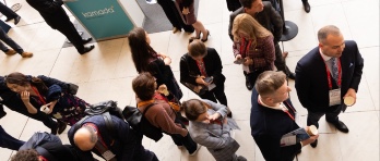 Photo from above of people gathered in a large space