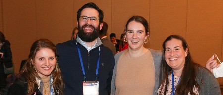 Four early career members smile for the camera at ISHLT2023