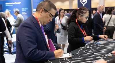 Man looking at surgical instruments in the ISHLT2025 Exhibit Hall