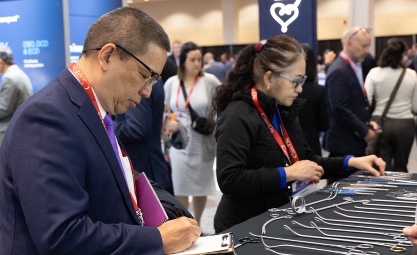 ISHLT2025 Attendees lookng at surgical instruments in the Exhibit Hall